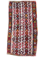 Vintage kilim rug in room decor setting, old rug, antique rug, pastel colors, faded colors, Turkish rug, vintage rug, soft rug, Portland, Oregon, rug store, rug shop, local shop, antique kilim rug, bold colors, bright colors