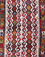 Vintage kilim rug in room decor setting, old rug, antique rug, pastel colors, faded colors, Turkish rug, vintage rug, soft rug, Portland, Oregon, rug store, rug shop, local shop, antique kilim rug, bold colors, bright colors