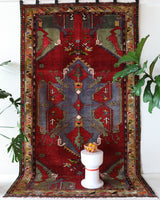 Vintage Turkish rug in a living room setting, pile rug, Turkish rug, vintage rug, portland, rug shop, bright colors, wild shaman, soft rug, bold color, Portland, Oregon, rug store, rug shop, local shop, antique rug