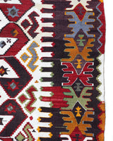 Vintage kilim rug in room decor setting, old rug, antique rug, pastel colors, faded colors, Turkish rug, vintage rug, soft rug, Portland, Oregon, rug store, rug shop, local shop, antique kilim rug, bold colors, bright colors