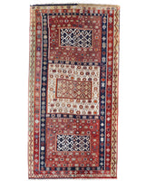 Vintage kilim rug in living room setting, old rug, antique rug, pastel colors, faded colors, Turkish rug, vintage rug, soft rug, Portland, Oregon, rug store, rug shop, local shop, earthy tones, earthy colors, warm colors