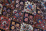 Antique Persian area rug in a living room setting, pile rug, vintage rug, portland, rug shop, bright colors, wild shaman, soft rug, bold color, Portland, Oregon, rug store, rug shop, local shop, antique rug, Persian rug, handmade rug, wool rug, distressed rug