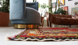 Vintage Turkish rug in a living room setting, pile rug, Turkish rug, vintage rug, portland, rug shop, bright colors, wild shaman, soft rug, bold color, Portland, Oregon, rug store, rug shop, local shop, antique rug