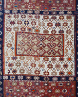 Vintage kilim rug in living room setting, old rug, antique rug, pastel colors, faded colors, Turkish rug, vintage rug, soft rug, Portland, Oregon, rug store, rug shop, local shop, earthy tones, earthy colors, warm colors