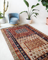 Vintage kilim rug in living room setting, old rug, antique rug, pastel colors, faded colors, Turkish rug, vintage rug, soft rug, Portland, Oregon, rug store, rug shop, local shop, earthy tones, earthy colors, warm colors
