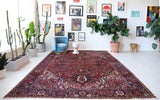 Antique Persian area rug in a living room setting, pile rug, vintage rug, portland, rug shop, bright colors, wild shaman, soft rug, bold color, Portland, Oregon, rug store, rug shop, local shop, antique rug, Persian rug, handmade rug, wool rug