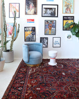 Antique Persian area rug in a living room setting, pile rug, vintage rug, portland, rug shop, bright colors, wild shaman, soft rug, bold color, Portland, Oregon, rug store, rug shop, local shop, antique rug, Persian rug, handmade rug, wool rug