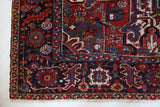 Antique Persian area rug in a living room setting, pile rug, vintage rug, portland, rug shop, bright colors, wild shaman, soft rug, bold color, Portland, Oregon, rug store, rug shop, local shop, antique rug, Persian rug, handmade rug, wool rug