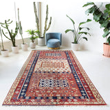 Vintage kilim rug in living room setting, old rug, antique rug, pastel colors, faded colors, Turkish rug, vintage rug, soft rug, Portland, Oregon, rug store, rug shop, local shop, earthy tones, earthy colors, warm colors