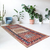 Vintage kilim rug in living room setting, old rug, antique rug, pastel colors, faded colors, Turkish rug, vintage rug, soft rug, Portland, Oregon, rug store, rug shop, local shop, earthy tones, earthy colors, warm colors