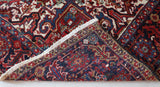 Antique Persian area rug in a living room setting, pile rug, vintage rug, portland, rug shop, bright colors, wild shaman, soft rug, bold color, Portland, Oregon, rug store, rug shop, local shop, antique rug, Persian rug, handmade rug, wool rug