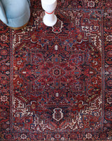 Antique Persian area rug in a living room setting, pile rug, vintage rug, portland, rug shop, bright colors, wild shaman, soft rug, bold color, Portland, Oregon, rug store, rug shop, local shop, antique rug, Persian rug, handmade rug, wool rug