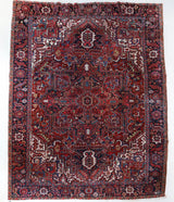 Antique Persian area rug in a living room setting, pile rug, vintage rug, portland, rug shop, bright colors, wild shaman, soft rug, bold color, Portland, Oregon, rug store, rug shop, local shop, antique rug, Persian rug, handmade rug, wool rug