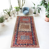 Vintage kilim rug in living room setting, old rug, antique rug, pastel colors, faded colors, Turkish rug, vintage rug, soft rug, Portland, Oregon, rug store, rug shop, local shop, earthy tones, earthy colors, warm colors