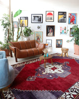 Vintage Turkish rug in a living room setting, pile rug, Turkish rug, vintage rug, portland, rug shop, bright colors, wild shaman, soft rug, bold color, Portland, Oregon, rug store, rug shop, local shop, antique rug