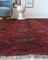 Antique Turkmen rug in a living room setting, pile rug, Turkish rug, vintage rug, portland, rug shop, bright colors, wild shaman, soft rug, bold color, Portland, Oregon, rug store, rug shop, local shop, antique rug