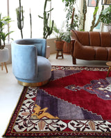 Vintage Turkish rug in a living room setting, pile rug, Turkish rug, vintage rug, portland, rug shop, bright colors, wild shaman, soft rug, bold color, Portland, Oregon, rug store, rug shop, local shop, antique rug