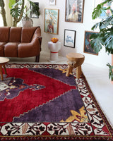 Vintage Turkish rug in a living room setting, pile rug, Turkish rug, vintage rug, portland, rug shop, bright colors, wild shaman, soft rug, bold color, Portland, Oregon, rug store, rug shop, local shop, antique rug