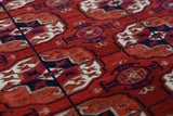 Antique Turkmen rug in a living room setting, pile rug, Turkish rug, vintage rug, portland, rug shop, bright colors, wild shaman, soft rug, bold color, Portland, Oregon, rug store, rug shop, local shop, antique rug