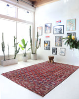 Antique Turkmen rug in a living room setting, pile rug, Turkish rug, vintage rug, portland, rug shop, bright colors, wild shaman, soft rug, bold color, Portland, Oregon, rug store, rug shop, local shop, antique rug