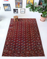 Antique Turkmen rug in a living room setting, pile rug, Turkish rug, vintage rug, portland, rug shop, bright colors, wild shaman, soft rug, bold color, Portland, Oregon, rug store, rug shop, local shop, antique rug