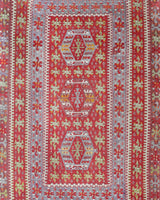 Vintage kilim rug in living room setting, old rug, antique rug, pastel colors, faded colors, Turkish rug, vintage rug, soft rug, Portland, Oregon, rug store, rug shop, local shop, earthy tones, earthy colors, warm colors