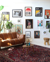 Antique Persian area rug in a living room setting, pile rug, vintage rug, portland, rug shop, bright colors, wild shaman, soft rug, bold color, Portland, Oregon, rug store, rug shop, local shop, antique rug, Persian rug, handmade rug, wool rug, distressed rug