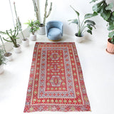 Vintage kilim rug in living room setting, old rug, antique rug, pastel colors, faded colors, Turkish rug, vintage rug, soft rug, Portland, Oregon, rug store, rug shop, local shop, earthy tones, earthy colors, warm colors