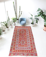 Vintage kilim rug in living room setting, old rug, antique rug, pastel colors, faded colors, Turkish rug, vintage rug, soft rug, Portland, Oregon, rug store, rug shop, local shop, earthy tones, earthy colors, warm colors