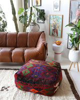 Floor pouf in a living room setting, pillow, turkish pillow, kilim pillow, home decor, decorative pillow, sham, rug pillow, decor, home decor, pouf, floor cushion, cushion, Portland, rugshop, Oregon, Wild Shaman, ottoman