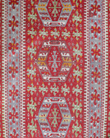 Vintage kilim rug in living room setting, old rug, antique rug, pastel colors, faded colors, Turkish rug, vintage rug, soft rug, Portland, Oregon, rug store, rug shop, local shop, earthy tones, earthy colors, warm colors