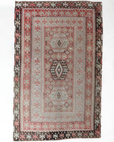 Vintage kilim rug in living room setting, old rug, antique rug, pastel colors, faded colors, Turkish rug, vintage rug, soft rug, Portland, Oregon, rug store, rug shop, local shop, earthy tones, earthy colors, warm colors