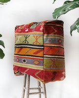 Floor pouf in a living room setting, pillow, turkish pillow, kilim pillow, home decor, decorative pillow, sham, rug pillow, decor, home decor, pouf, floor cushion, cushion, Portland, rugshop, Oregon, Wild Shaman, ottoman