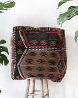 Floor pouf in a living room setting, pillow, turkish pillow, kilim pillow, home decor, decorative pillow, sham, rug pillow, decor, home decor, pouf, floor cushion, cushion, Portland, rugshop, Oregon, Wild Shaman, ottoman