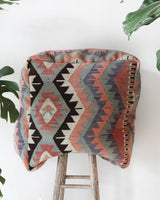 Floor pouf in a living room setting, pillow, turkish pillow, kilim pillow, home decor, decorative pillow, sham, rug pillow, decor, home decor, pouf, floor cushion, cushion, Portland, rugshop, Oregon, Wild Shaman, ottoman