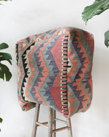 Floor pouf in a living room setting, pillow, turkish pillow, kilim pillow, home decor, decorative pillow, sham, rug pillow, decor, home decor, pouf, floor cushion, cushion, Portland, rugshop, Oregon, Wild Shaman, ottoman