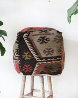 Floor pouf in a living room setting, pillow, turkish pillow, kilim pillow, home decor, decorative pillow, sham, rug pillow, decor, home decor, pouf, floor cushion, cushion, Portland, rugshop, Oregon, Wild Shaman, ottoman