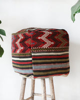 Floor pouf in a living room setting, pillow, turkish pillow, kilim pillow, home decor, decorative pillow, sham, rug pillow, decor, home decor, pouf, floor cushion, cushion, Portland, rugshop, Oregon, Wild Shaman, ottoman