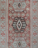 Vintage kilim rug in living room setting, old rug, antique rug, pastel colors, faded colors, Turkish rug, vintage rug, soft rug, Portland, Oregon, rug store, rug shop, local shop, earthy tones, earthy colors, warm colors