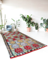 Vintage kilim rug in living room setting, bright colors, wild shaman, soft rug, bold color, Portland, Oregon, rug store, rug shop, local shop, vintage rug, modern kilim, warm colors, antique kilim rug