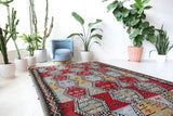 Vintage kilim rug in living room setting, bright colors, wild shaman, soft rug, bold color, Portland, Oregon, rug store, rug shop, local shop, vintage rug, modern kilim, warm colors, antique kilim rug