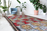 Vintage kilim rug in living room setting, bright colors, wild shaman, soft rug, bold color, Portland, Oregon, rug store, rug shop, local shop, vintage rug, modern kilim, warm colors, antique kilim rug