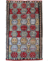 Vintage kilim rug in living room setting, bright colors, wild shaman, soft rug, bold color, Portland, Oregon, rug store, rug shop, local shop, vintage rug, modern kilim, warm colors, antique kilim rug