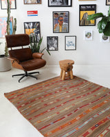 Vintage kilim rug in living room setting, old rug, antique rug, pastel colors, faded colors, Turkish rug, vintage rug, soft rug, Portland, Oregon, rug store, rug shop, local shop, earthy tones, earthy colors, warm colors