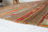 Vintage kilim rug in living room setting, old rug, antique rug, pastel colors, faded colors, Turkish rug, vintage rug, soft rug, Portland, Oregon, rug store, rug shop, local shop, earthy tones, earthy colors, warm colors