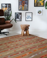 Vintage kilim rug in living room setting, old rug, antique rug, pastel colors, faded colors, Turkish rug, vintage rug, soft rug, Portland, Oregon, rug store, rug shop, local shop, earthy tones, earthy colors, warm colors