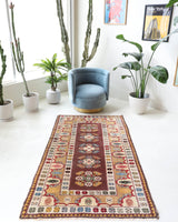 Vintage Turkish rug in living room setting, old rug, antique rug, pastel colors, faded colors, Turkish rug, vintage rug, soft rug, Portland, Oregon, rug store, rug shop, local shop