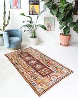 Vintage Turkish rug in living room setting, old rug, antique rug, pastel colors, faded colors, Turkish rug, vintage rug, soft rug, Portland, Oregon, rug store, rug shop, local shop