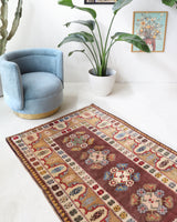 Vintage Turkish rug in living room setting, old rug, antique rug, pastel colors, faded colors, Turkish rug, vintage rug, soft rug, Portland, Oregon, rug store, rug shop, local shop