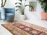 Vintage Turkish rug in living room setting, old rug, antique rug, pastel colors, faded colors, Turkish rug, vintage rug, soft rug, Portland, Oregon, rug store, rug shop, local shop
